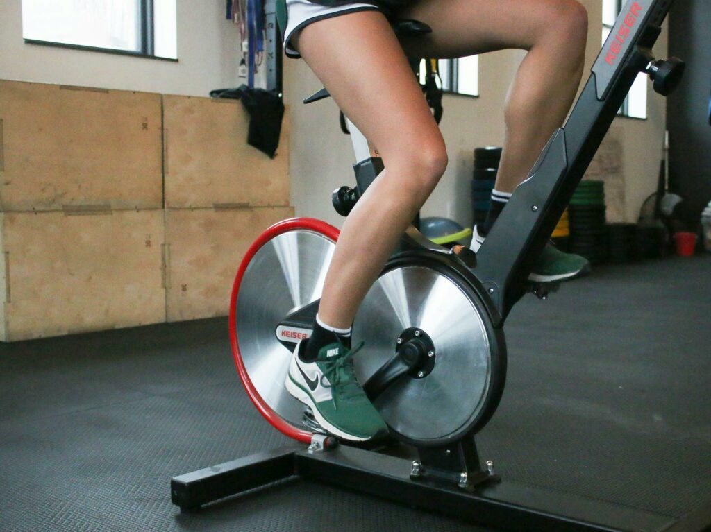 woman-cycling-on-stationary-spin-bike