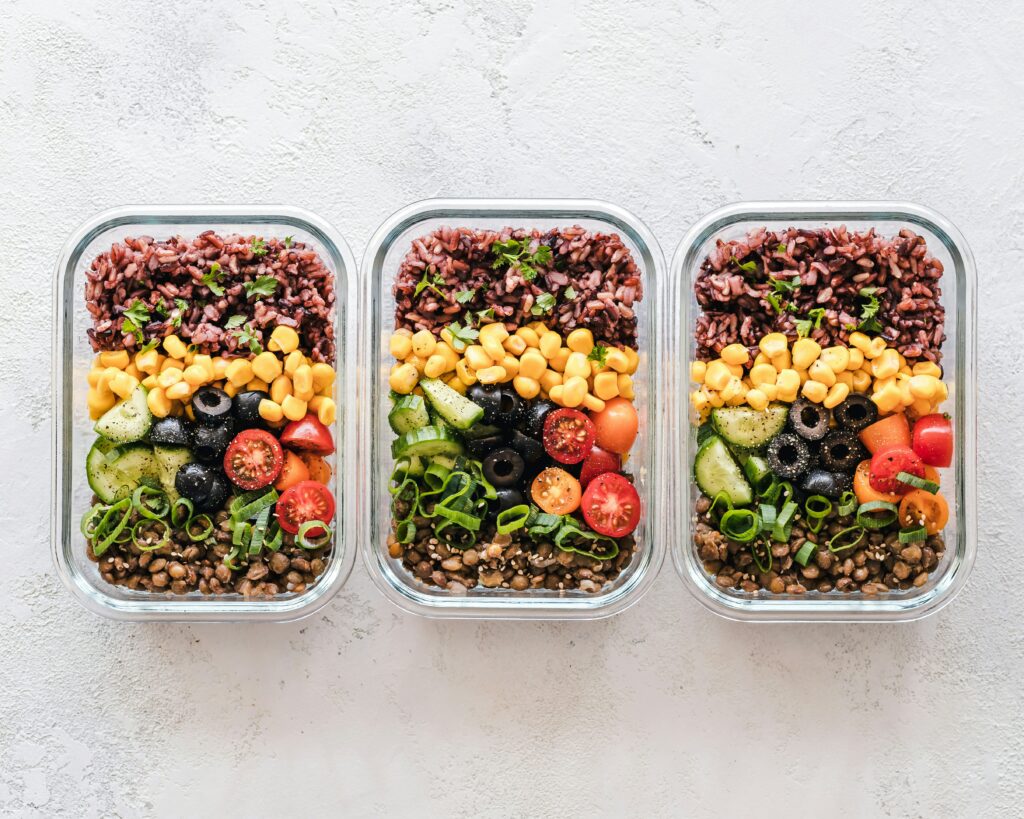 three-meal-prep-containers-with-prepped-food